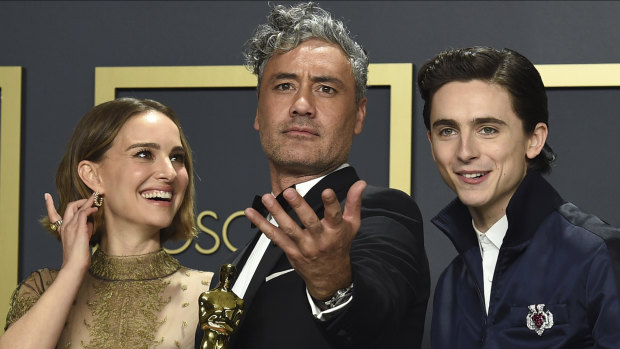 Adapted screenplay Oscar winner Taika Waititi (centre), with Natalie Portman and Timothee Chalamet, at the Oscars.