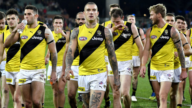 Dustin Martin leads the dispirited Tigers off after another loss in 2019, this time to Adelaide.
