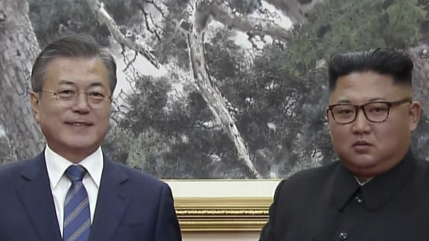 South Korean President Moon Jae-in, left, and North Korean leader Kim Jong-un pose after signing documents in Pyongyang, North Korea.