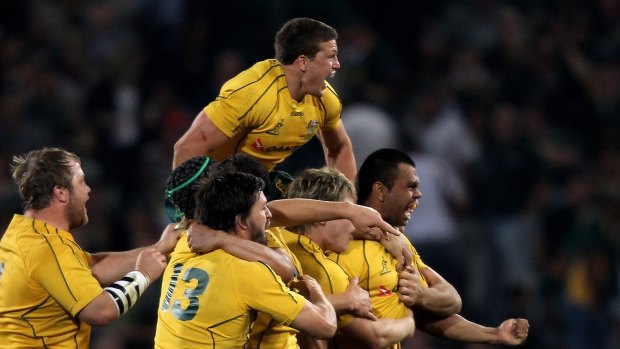Kurtley Beale is mobbed by teammates after kicking a penalty in 2010 to help the Wallabies break a 47-year drought on the highveld. 