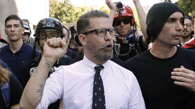 Gavin McInnes, centre, founder of the far-right group Proud Boys, is surrounded by supporters after speaking at a rally in Berkeley, California.