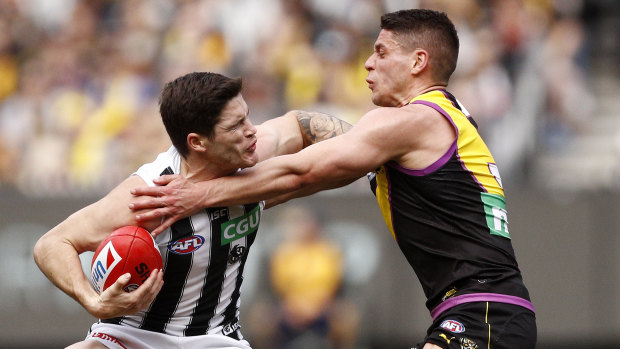 Jack Crisp fends off Dion Prestia.