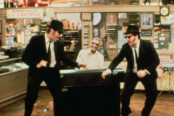 Dan Aykroyd and John Belushi, with Ray Charles at the piano, in The Blues Brothers.