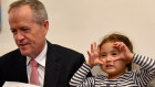 Bill Shorten reading "The Very Hungry Caterpillar" to kids