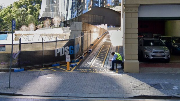 The Margaret Street entrance to Beatrice Lane in August 2019, protected by two security guards.