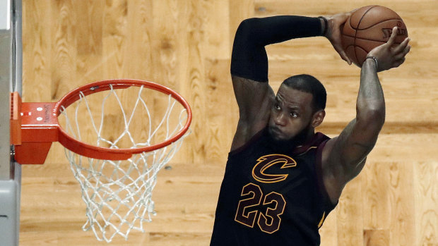 LeBron show: James flies in for a dunk as he leads Cleveland to victory over the Celtics. 