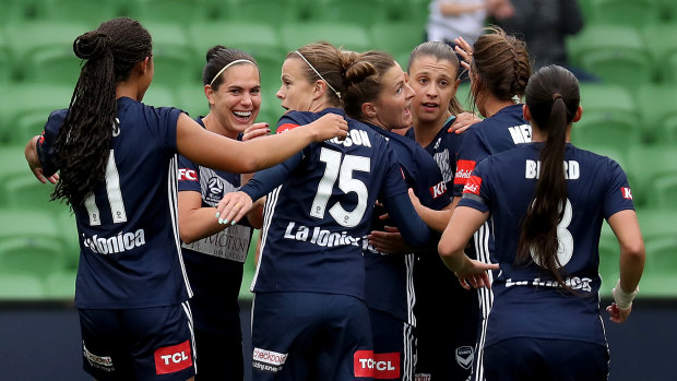 Cause for celebration: Melbourne Victory players gather in delight after Natasha Dowie opened the scoring against the Newcastle Jets at AAMI Park in Melbourne.