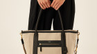 Hemp Black’s vegan leather is used as the handles of a new Oroton X tote and backpack.