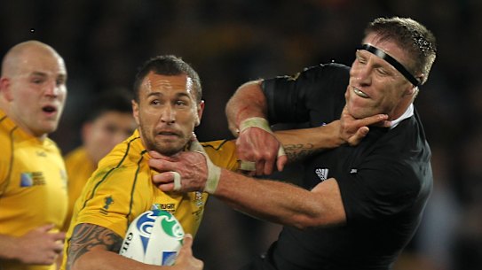 Actions speak louder: Quade Cooper refused to criticise now Reds coach Brad Thorn (right) but did post a similar image to social media.