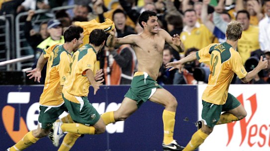 A shirtless John Aloisi celebrates scoring the penalty against Uruguay that put Australia into the 2006 World Cup.