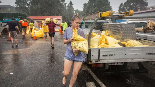 Brisbane residents collecting sandbags as ex-cyclone Debbie dumped heavy rain over the city in March, 2017.