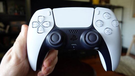 The DualSense design mimmicks the console itself with curving white panels over black., and a colour-changing light strip around the central touchpad. 