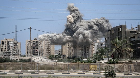 Smoke from a bomb blast during an Israeli airstrike on the Ain Jalut towers in Nuseirat, central Gaza, on Saturday, July 20, 2024. The Israeli military ordered civilians to leave parts of the Gazan city of Khan Younis due to a renewed assault against Hamas, even as it reduced the size of an already overcrowded humanitarian zone where they could potentially take shelter. Photographer: Ahmad Salem/Bloomberg