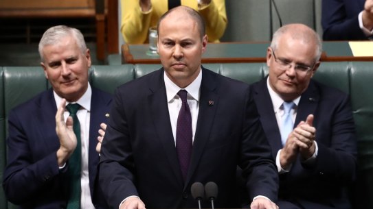 Treasurer Josh Frydenberg handing down last year's federal budget. A promised $7.1 billion surplus has been replaced with a near $84 billion deficit with even more red ink to come.