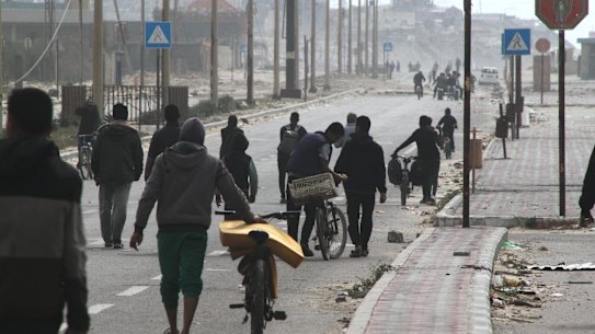 Displaced Palestinians on the coastal road after fleeing the Al-Shifa hospital area in north Gaza.