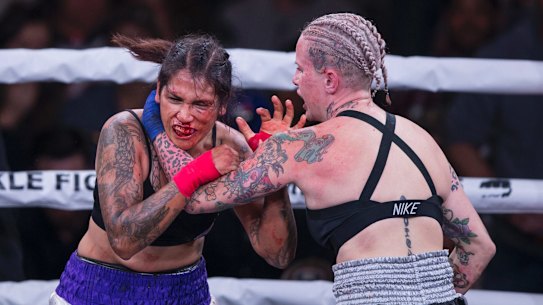 Alma Garcia, left, takes a hit from Bec Rawlings during a 125-pound bout at the Bare Knuckle Fighting Championship in 2018. Rawlings will fight in Perth at the BKFC event on July 19.