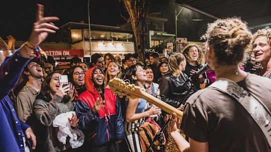 Crowds inundated the streets of Byron Bay after Splendour in the Grass cancelled its first day due to bad weather. People waited in long queues to enter venues. Local band The Seeding played for eight hours to keep the swelling crowd amused.