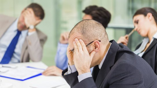 This stock image of ‘stressed out office workers’ accurately reflects how this whole scenario made me feel.