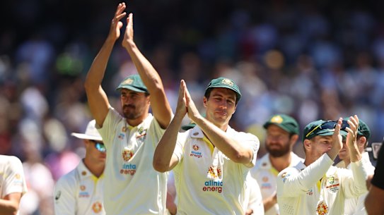 MELBOURNE, AUSTRALIA - DECEMBER 28: Pat Cummins (C)of Australia applauds with teammates after winning and retaining the Ashes on day three of the Third Test match in the Ashes series between Australia and England at Melbourne Cricket Ground on December 28, 2021 in Melbourne, Australia. (Photo by Robert Cianflone/Getty Images)