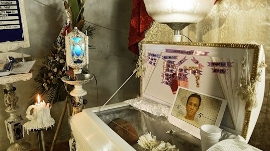 The body of Ramil Miranda,35, lies in his coffin at his wake in the Manila suburb of Malabon. The known drug user was a victim of an extra judicial killing in 2017. 