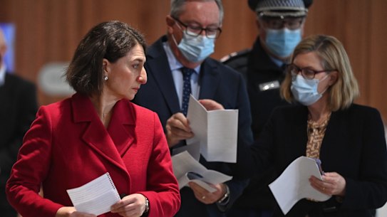 Former premier Gladys Berejiklian, Dr Kerry Chant and Health Minister Brad Hazzard in July during the lockdown.