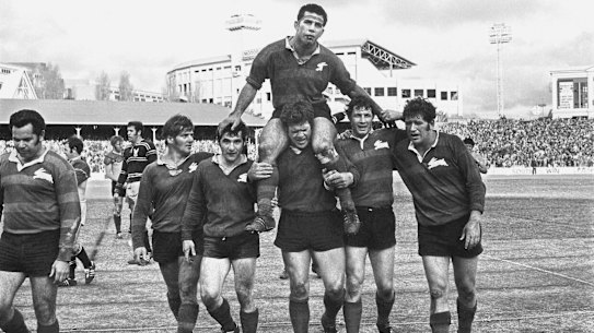 THE BIG PICTURE
Souths, with 20, has won more Sydney rugby league premierships than any other club. But it's been a long time between drinks, Captain John Sattler, his jaw broken and teeth smashed, is chaired off the Sydney Cricket Ground by teammates in 1970 after the club's last grand final victory. (Photo: John O'Gready)

FAIRFAX ARCHIVE RICH AND RARE / SPORT / NEG 9 Rugby League Grand Final on 19 September 1970. Souths versus Manly at the SCG. SMH SPORT Picture by John O'GREADY/ Alan PURCELL / SHARPE. Souths captain John Sattler chaired off by team-mates after having his jaw broken and teeth smashed during altercation early in the Grand Final with Manly front row forward John Bucknall. Sattler played out the game which Souths won 23-12.**PLEASE NOTE, NOT TO BE USED BEFORE PUBLICATION OF THE RICH AND RARE BOOK - 2006**