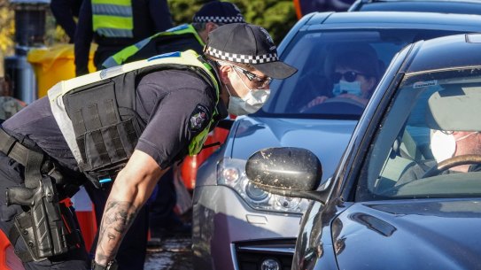 Victoria Police checking motorists leaving Melbourne at a checkpoint last year.  