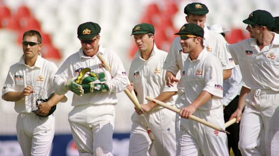 Ian Healy and the Australian team walk off the field after defeating Pakistan at Rawalpindi stadium in 1998. 