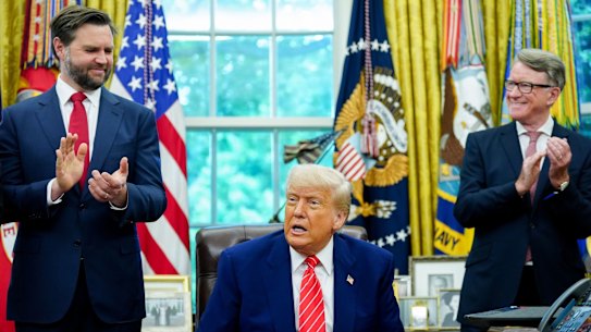 Vice President J.D. Vance, President Donald Trump and British ambassador Peter Mandelson applaud a trade deal between the UK and US.
