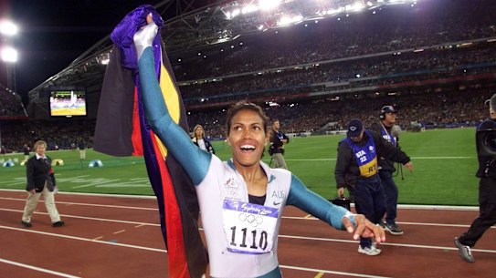 Cathy Freeman celebrates after winning gold at the Sydney Olympics.