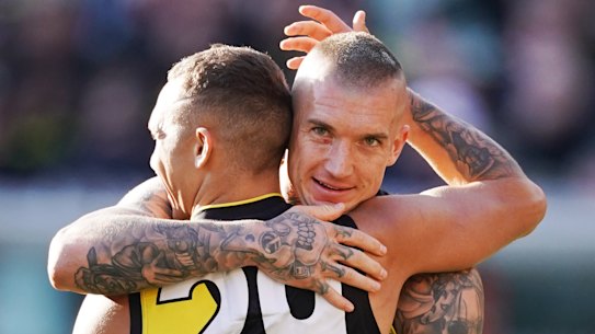 Shai Bolton of the Tigers celebrates a goal with Dustin Martin.