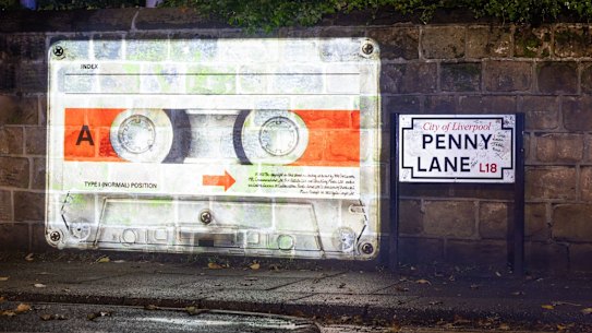 A mysterious cassette tape was projected onto a wall on Penny Lane to promote The Beatles’ announcement of the release of their “final” song ‘Now And Then’.