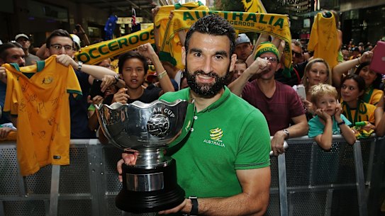 SYDNEY, AUSTRALIA - FEBRUARY 01:  Socceroos captain Mile Jedinak poses with the Asian Cup during celebrations at Westfield Sydney on February 1, 2015, after the Socceroos won the 2015 Asian Cup last night, in Sydney, Australia.  (Photo by Mark Metcalfe/Getty Images)