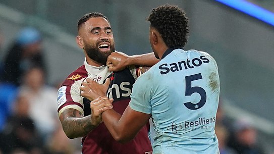 Miles Amatosero tangles with Lukhan Salakaia-Loto in the last Waratahs-Reds clash, in round 13 last year.