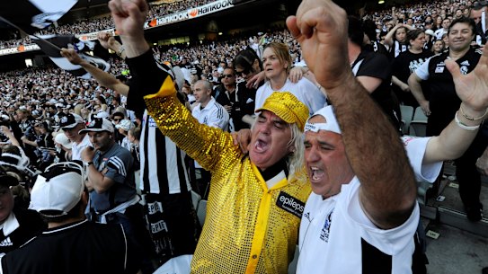 Joffa celebrates in the last quarter of the 2010 grand final replay with Collingwood fans.