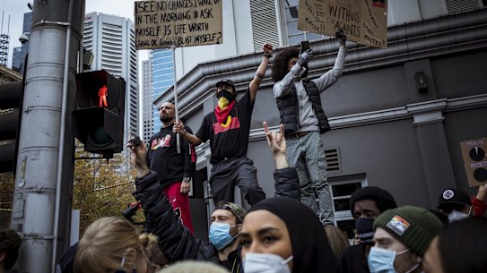 Protesters urging action on Indigenous deaths in custody at the Black Lives Matter rally in Melbourne.