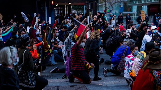 This afternoon in Sydney, hundreds marched against the injustices of over 400 indigenous Australian deaths whilst in custody throughout Australia. This evening was also in solidarity with those across America  who have take to the streets across the states, seeking justice for  George Floyd, who last week died at the hands of Minneapolis police officers. Sydney Town Hall. Saturday 6th June 2020. Photograph James Brickwood. SMH NEW 200606 Coronavirus COVID-19