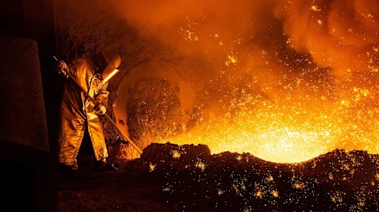 A worker at a blast furnace at the Salzgitter AG mill in Salzgitter in Germany where green steel processes are being explored.