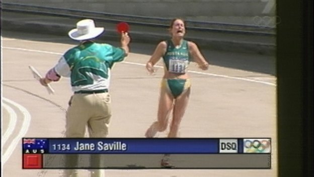 wlk000928.001.003.jpg  Jane Saville being disqualified by an official from the walking race during the 2000 Sydney Olympics. The official holds up the red card.
***FDCTRANSFER***