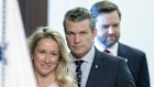 Pete Hegseth, US secretary of defense, center, with his wife Jennifer Rauchet Hegseth, left, and US Vice President J.D. Vance