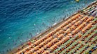 Tourists at beach clubs in Positano, Italy.
