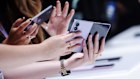 New device shapes from Samsung and Apple are expected to boost sales of expensive phones at a time when sales of inexpensive handsets are plummeting.