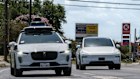 A Waymo autonomous taxi, left, in Austin, Texas earlier this year.