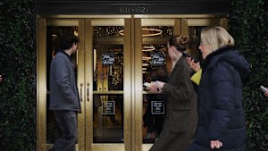 Shoppers pass a Saks Fifth Avenue store in New York. Saks Global has filed for bankruptcy protection.