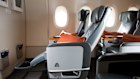 A Singapore Airlines premium economy seat comes with calf and footrests and a generous recline. Book the Cook meals are available.