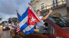Members of the “Gran Caravana” (Big Caravan), pass the Cuba-centric San Carlos Institute in Key West, Florida, on Wednesday rallying support for the Cuban people.