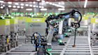 A robotic arm picks and packs groceries at Ocado in the UK. Ocado’s technological progress means the company requires 500 fewer workers this year, after it already announced 2300 jobs would be at risk in 2023.
