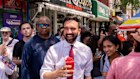 Zohran Mamdani, New York City mayoral candidate, holds a shaved ice during a campaign event.