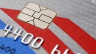 This Wednesday, June 10, 2015 photo shows a chip-based credit card, in Philadelphia. U.S. banks, tired of spending billions a year to pay back fleeced consumers, are in the process of replacing tens of millions of credit and debit cards equipped with computer chips that store account data more securely. (AP Photo/Matt Rourke)