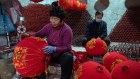 Workers make traditional lanterns at a factory in the village of Tuntou in Hebei Province ahead of Chinese new year.